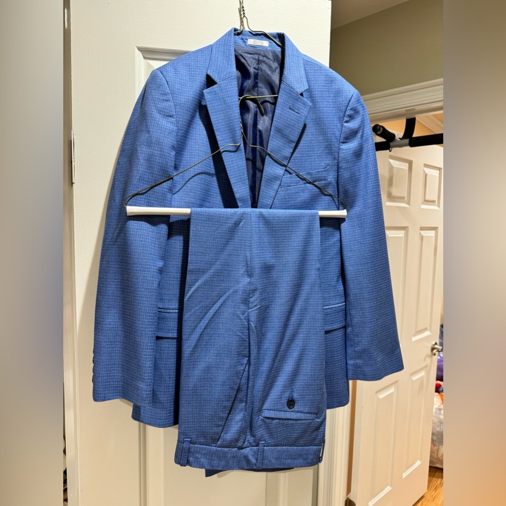Boys suit size 14 blue color. Like new condition. Has been dry cleaned.
